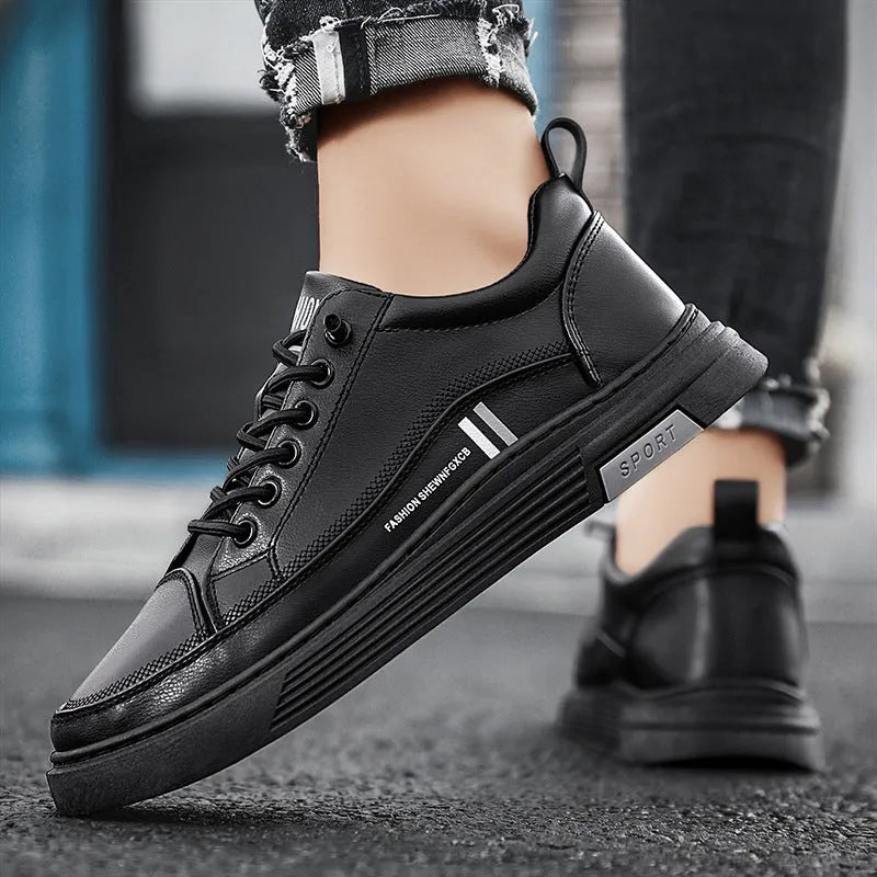 Men's white skate shoes with elastic band closure and low-top design showing stitching details