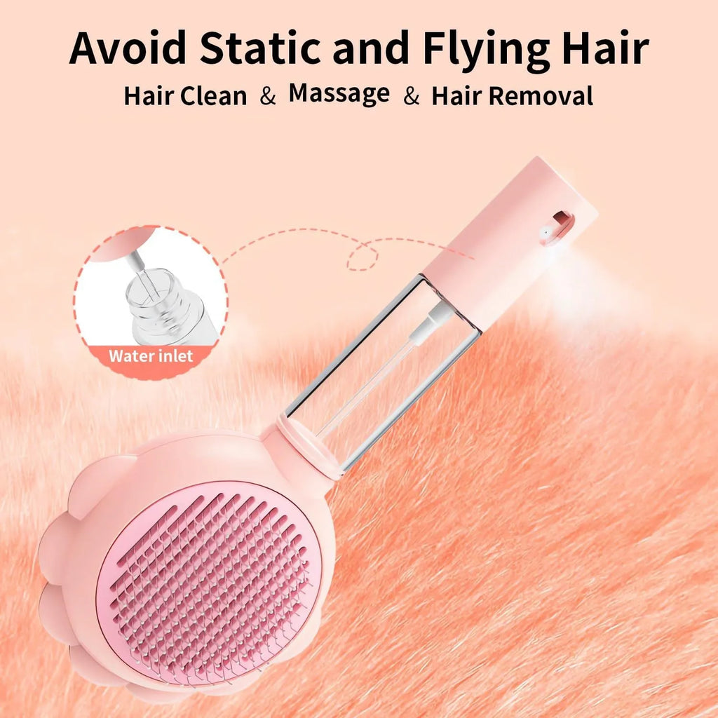 Grey spray cat brush with release button and stainless steel bristles for pet grooming.