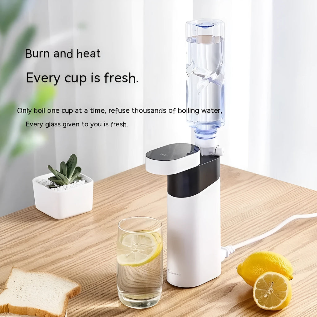 Black and green compact desktop instant hot water dispenser with digital display and water tank.