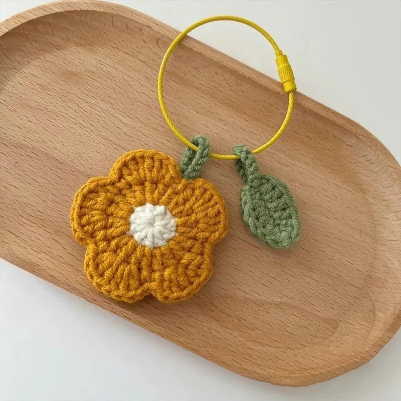 Hand-crocheted wool flower pendant in small red or yellow design for craft and jewellery projects