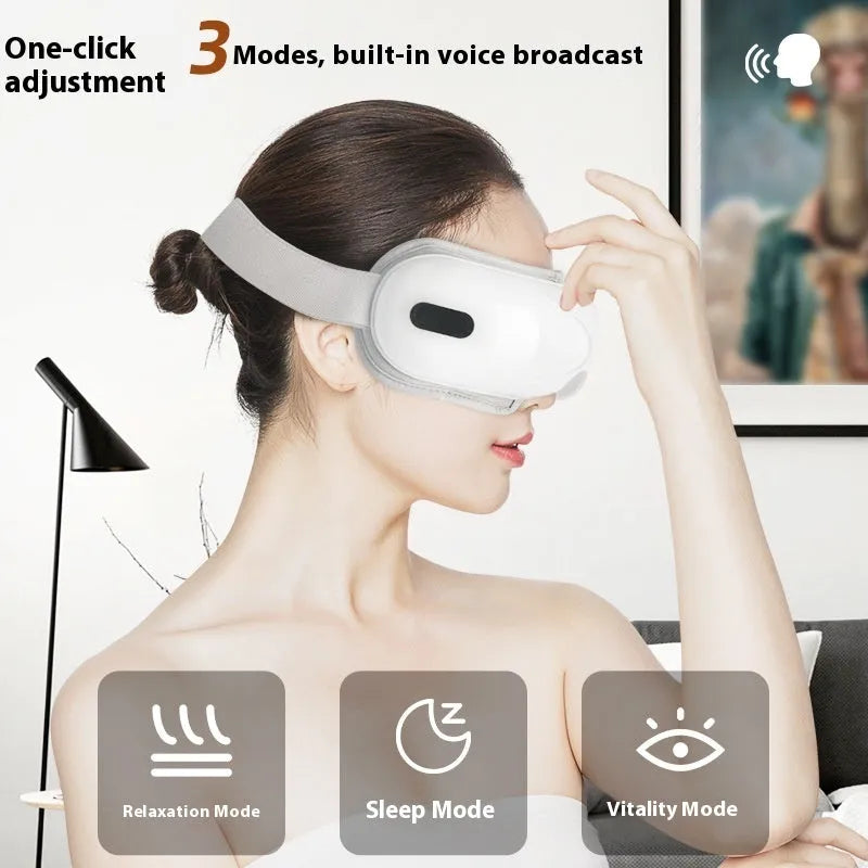 White rechargeable airbag massage and hot compress eye massager with charging cable