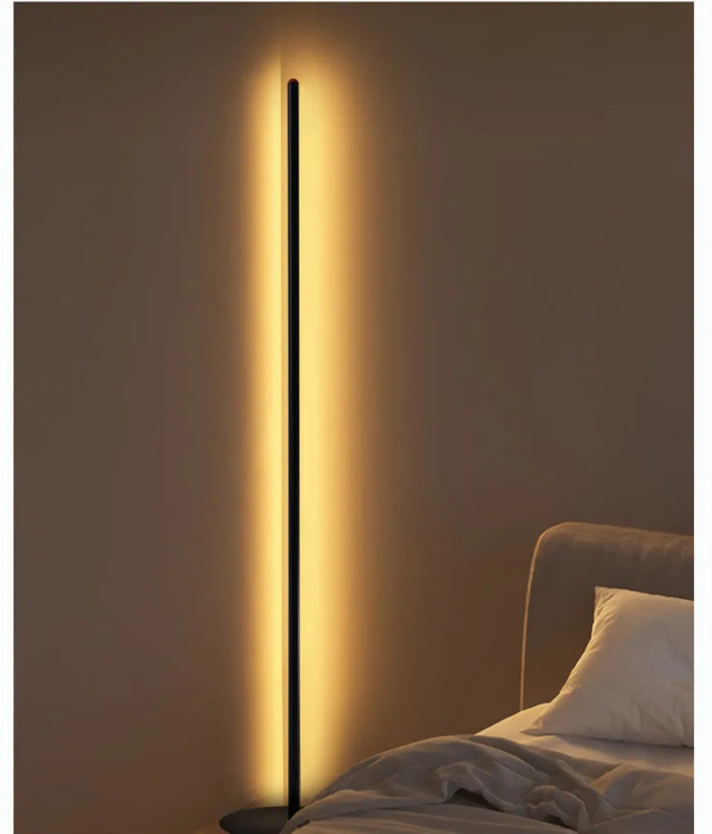 Tall, slim aluminium alloy vertical floor lamp with a simple design and LED light.
