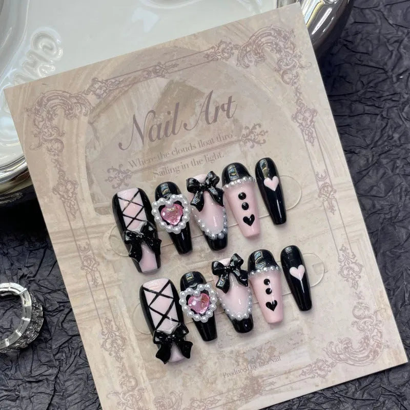 Hand-painted black pink heart design plastic nail armour set in four sizes