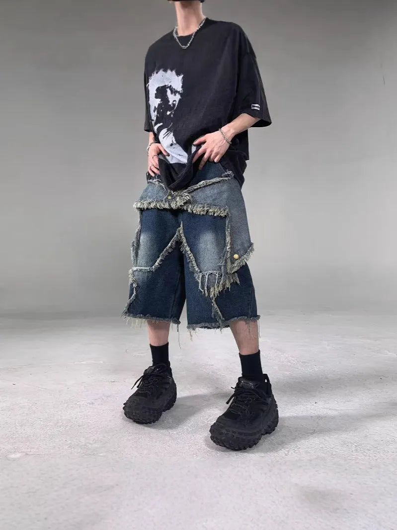 Blue denim shorts with frayed five-pointed star detailing and loose retro styling