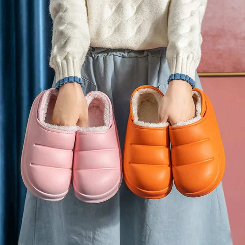 Women's waterproof EVA slippers in various colours with plush lining and a non-slip flat sole.